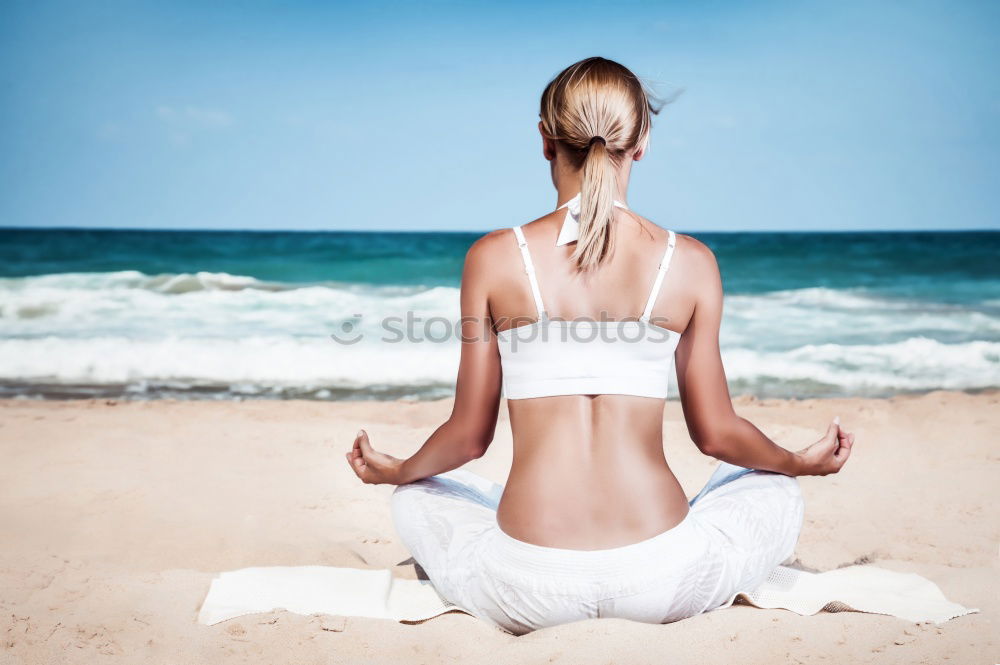 Similar – Caucasian blonde woman practicing yoga in the beach