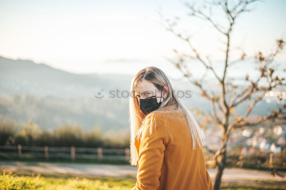 Similar – A young woman looking at a tree.