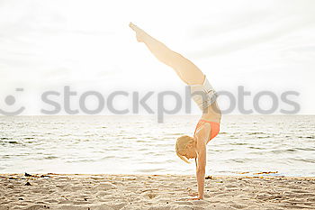 Similar – Image, Stock Photo Caucasian blonde woman practicing yoga in the beach