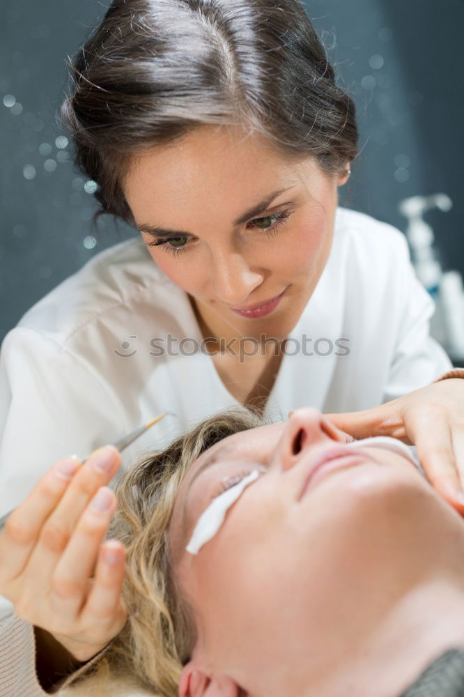 Similar – Massage therapist doing lymphatic drainage treatment to woman