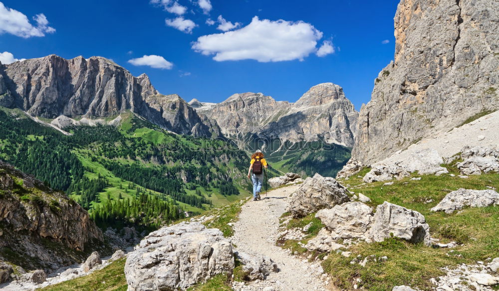 Similar – Hiking trail with hiker with panoramic view in the Dolomites