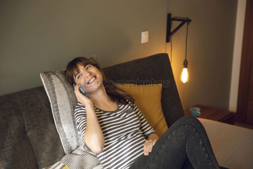 Similar – Young woman sitting in windowsill in sunlit kitchen smiling at camera