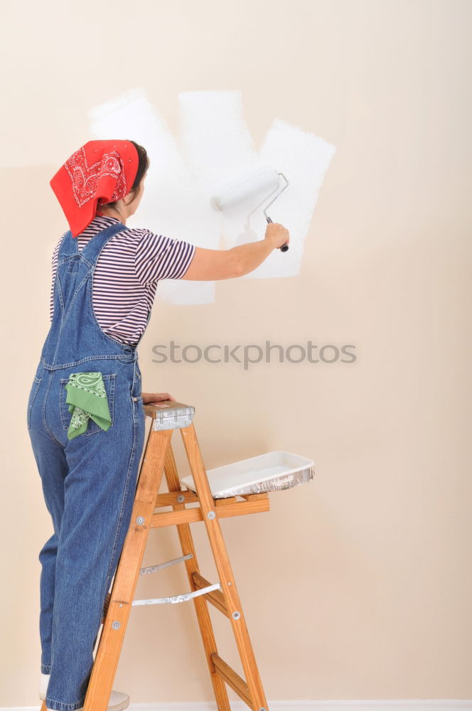 Similar – Worker with corner and pencil in hand