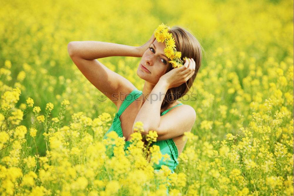 Similar – Image, Stock Photo Happy summer love woman sitting smiling in canola field. Attractive young beauty girl enjoying the warm sunny sun in nature, taking time to feel sustainability, reflection and youthful well-being.