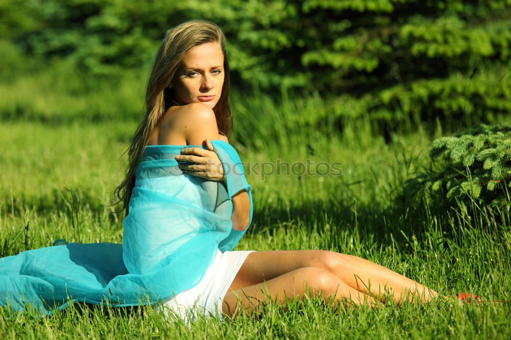 Similar – sad young woman leaning against tree