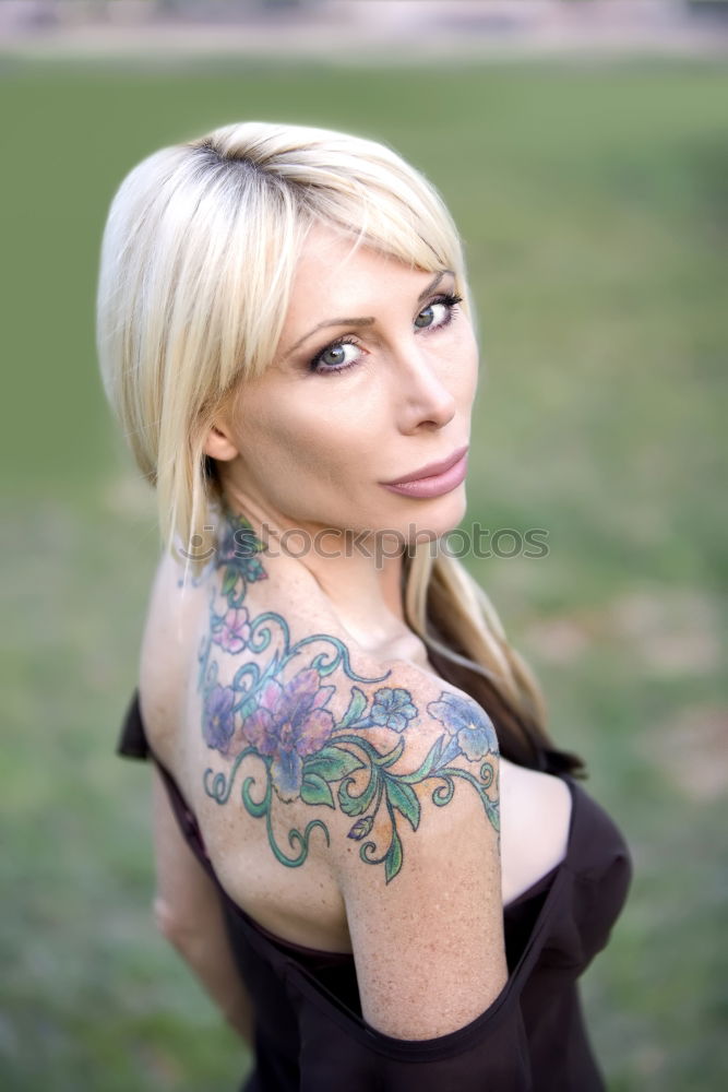 Similar – Beautiful and tattooed young woman