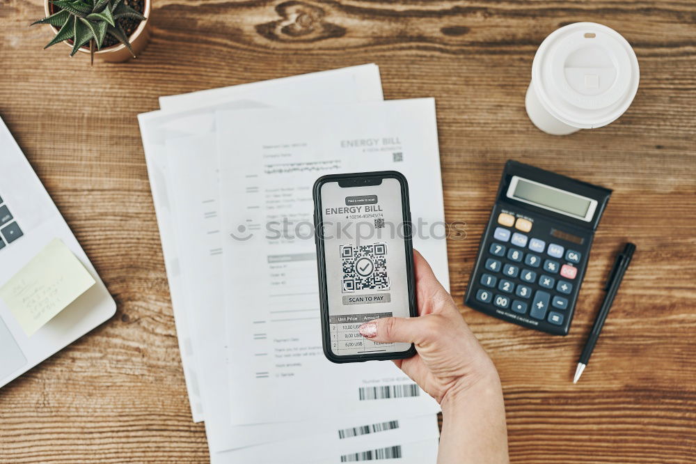 Similar – Woman paying invoice scanning QR code from document using fast secure payment system and smartphone QR scanner. Business woman paying bills using express payment technology. Paying expenses online