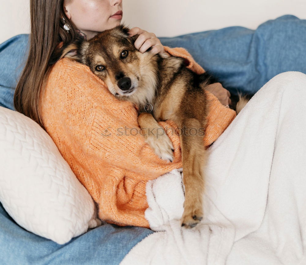 Similar – Young happy woman hugging her dog