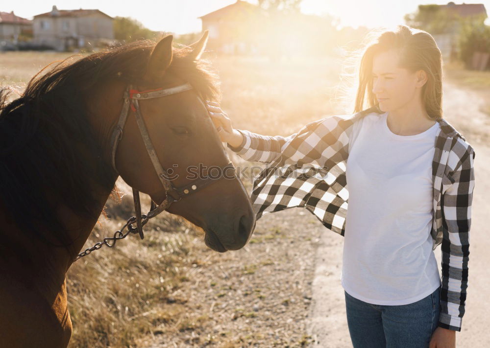 Similar – Image, Stock Photo Beautiful young rider woman with horse in nature. Love and friendship between man and animal. Portrait in landscape near horse stable of riding farm with riding school or farm with pet for hobby riding.