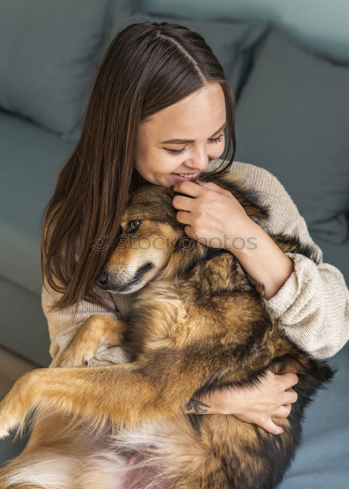 Similar – A pretty girl hugs her pet while kissing her