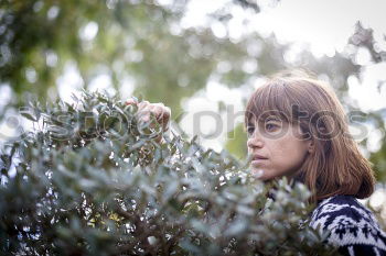 Portrait of a blue-eyed hiker looking at camera in the forest