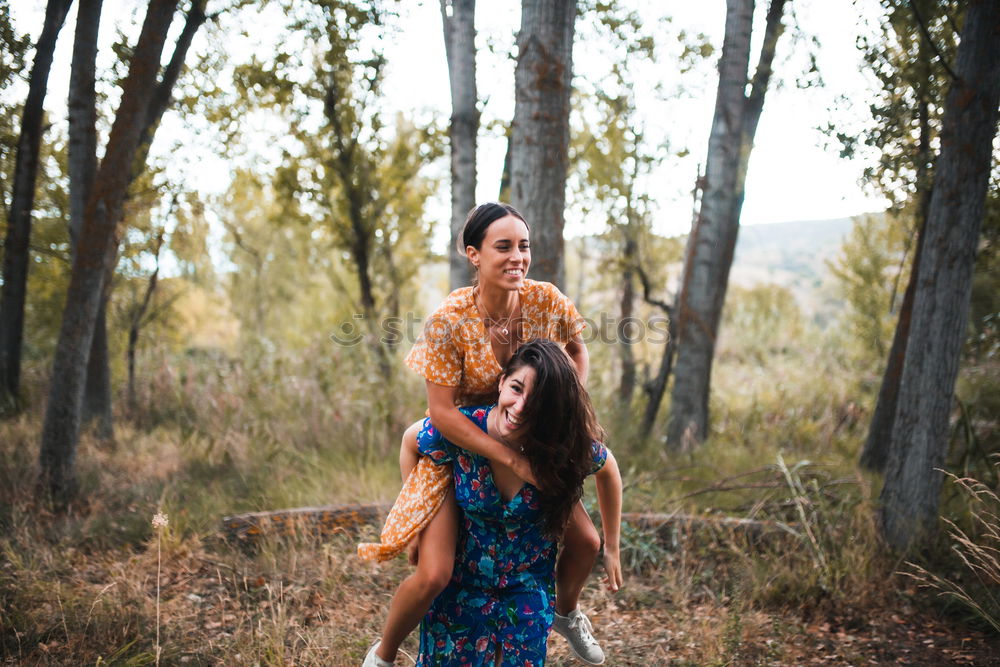 Similar – Three happy friends  posing in the forest