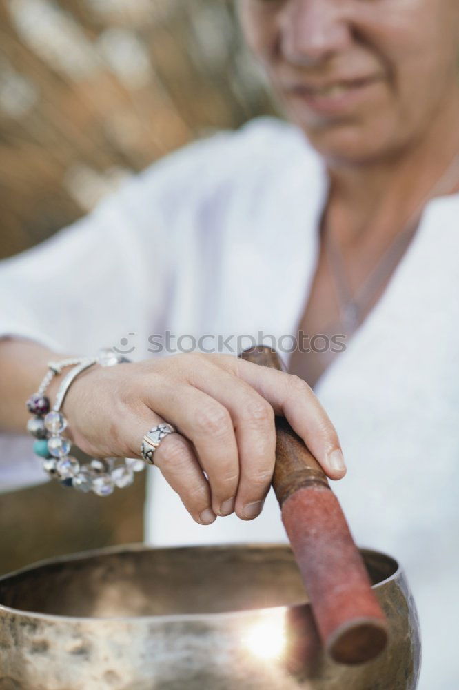 Similar – Image, Stock Photo Hand playing yoga bowls outdoors.