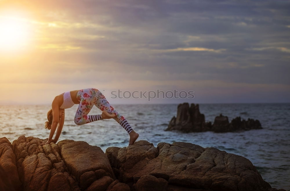 Similar – Athletic man balancing on gymnastic rings