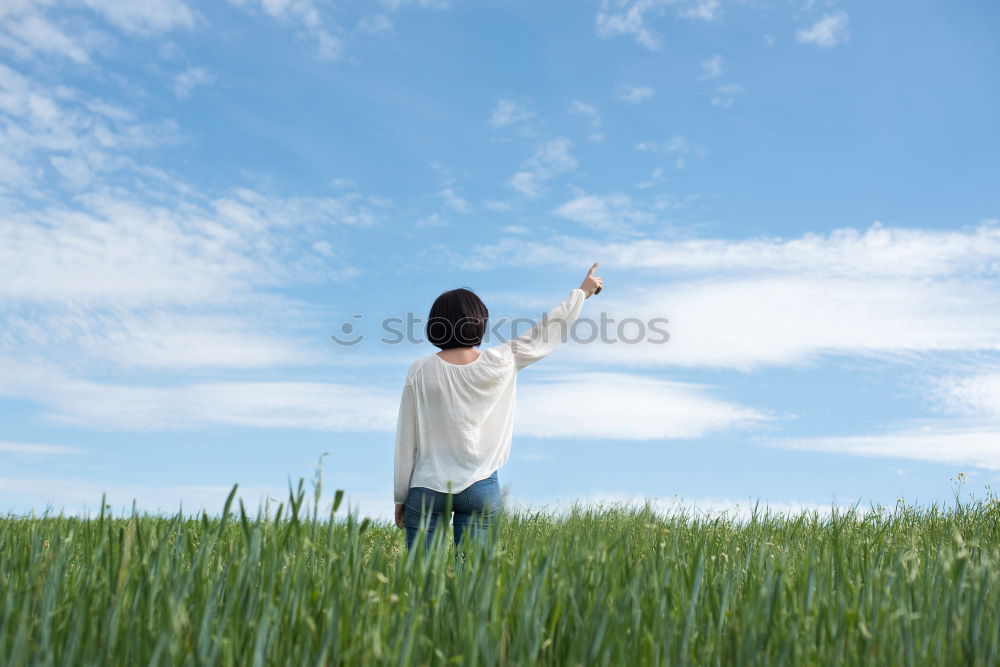 Similar – Young blonde woman on hill with globe in hands