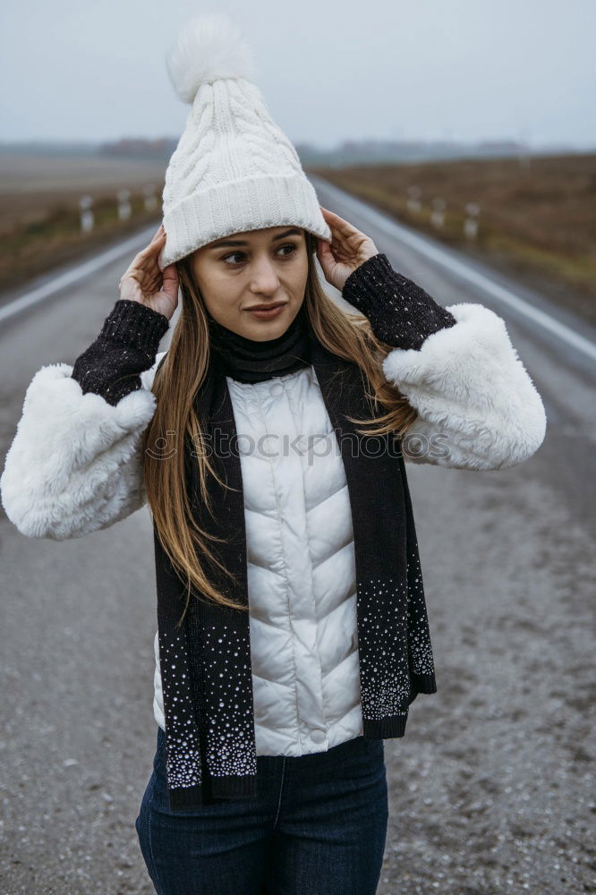 Similar – Woman in Winter Outfit in Front Old Gray Wall