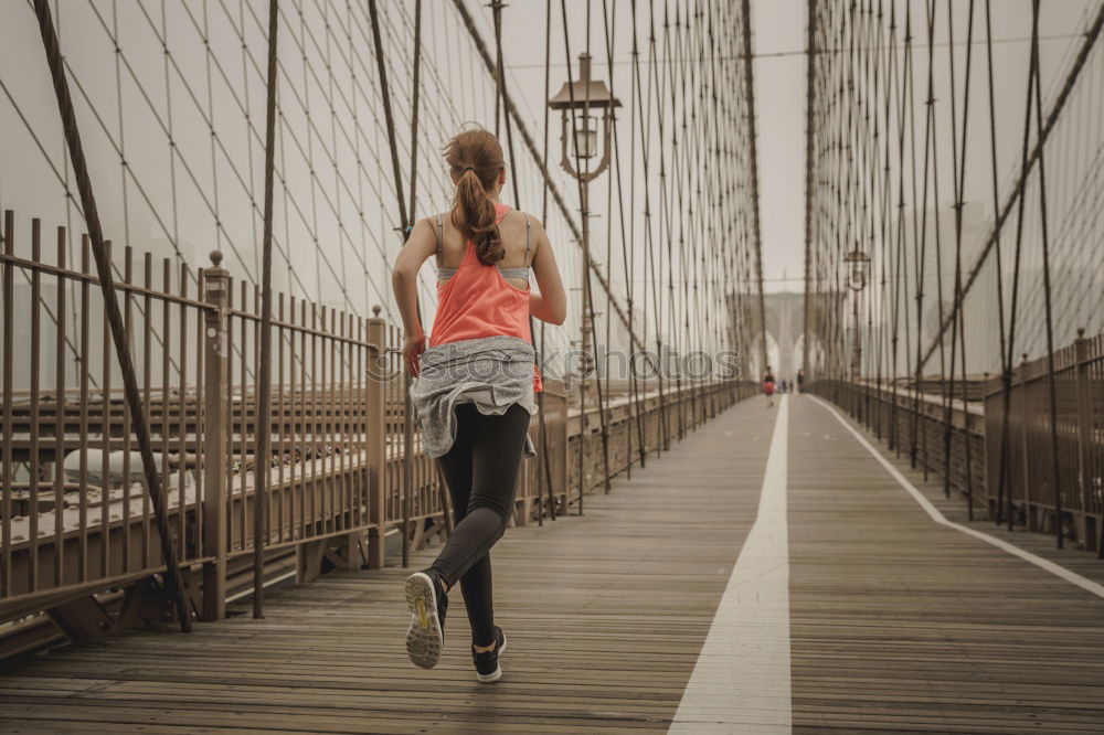 Image, Stock Photo Young fit blonde woman running on the bridge