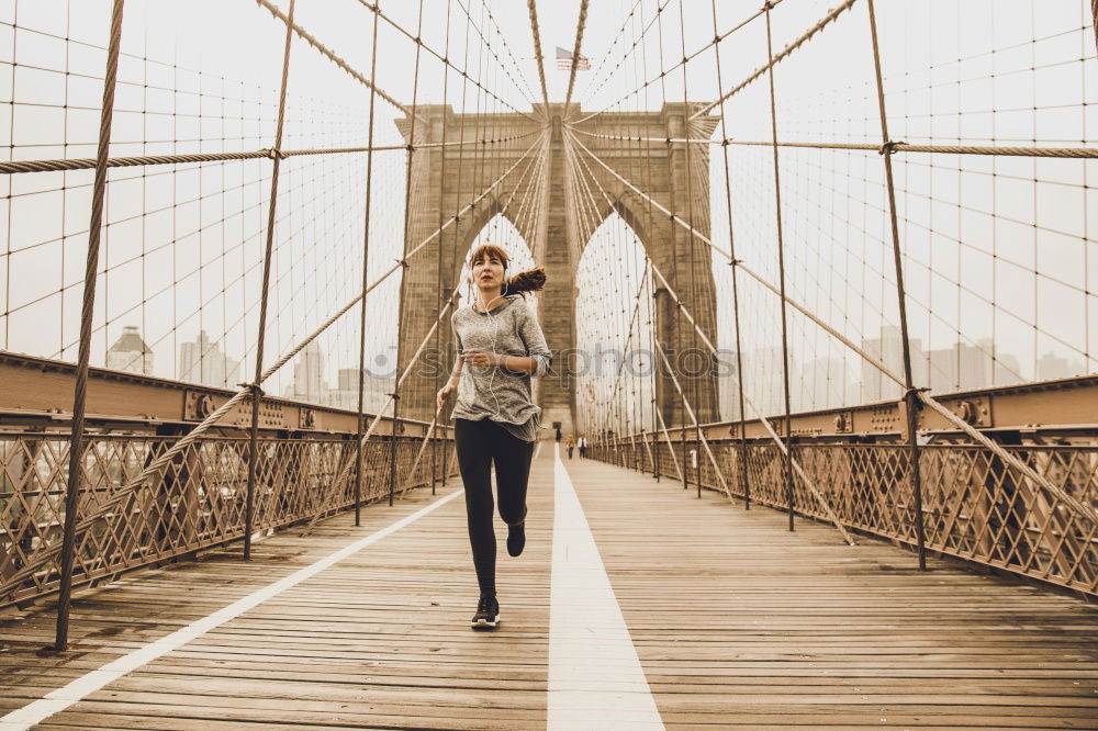 Similar – Stylish woman sitting near bridge in old city