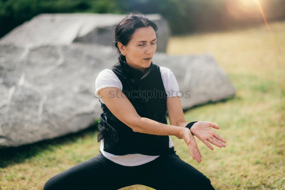 Similar – Beautiful young woman meditates in yoga asana Padmasana