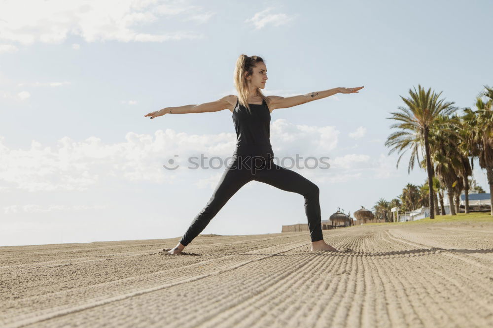 Woman stretching legs in park