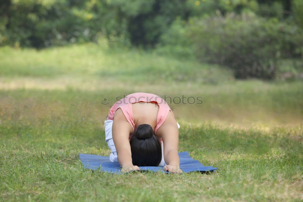 Young woman doing yoga in nature.