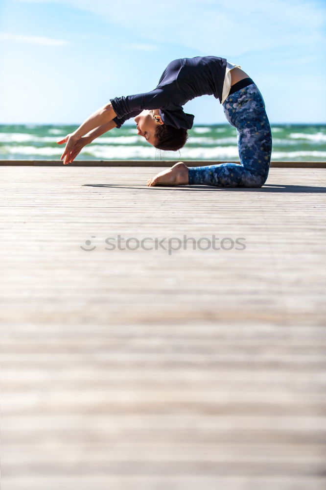 Similar – Black fit woman doing fitness acrobatics