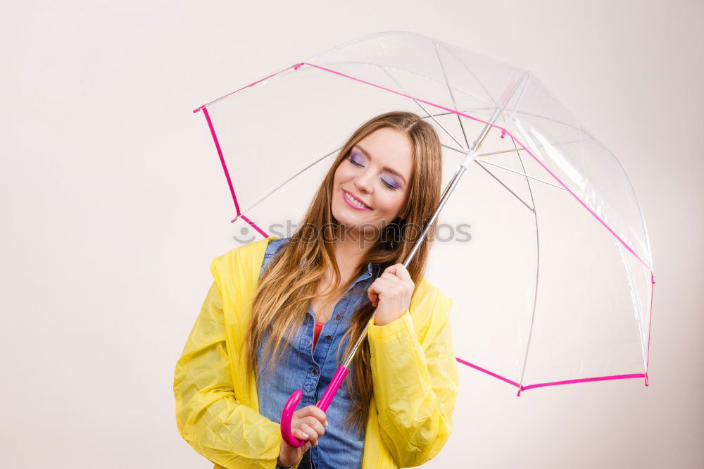 Similar – Image, Stock Photo Woman walking with umbrella in front of green wall