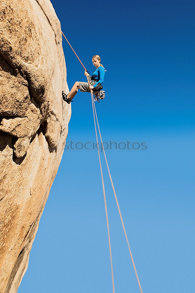 Rock climber falling upside down.