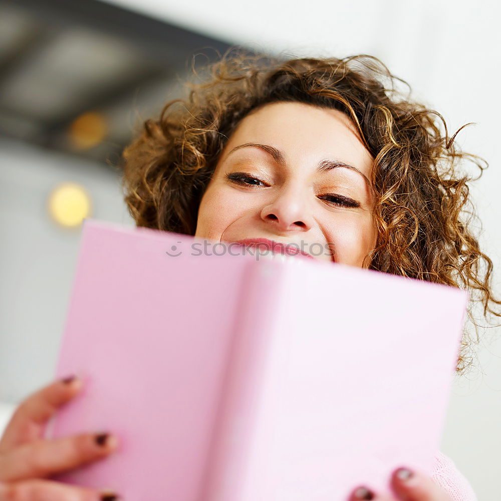 Similar – Image, Stock Photo Young girl putting the books into paper bag in bookstore