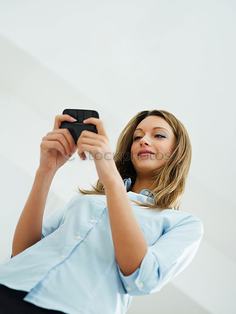 Similar – Image, Stock Photo Happy young woman on the tablet by the wall