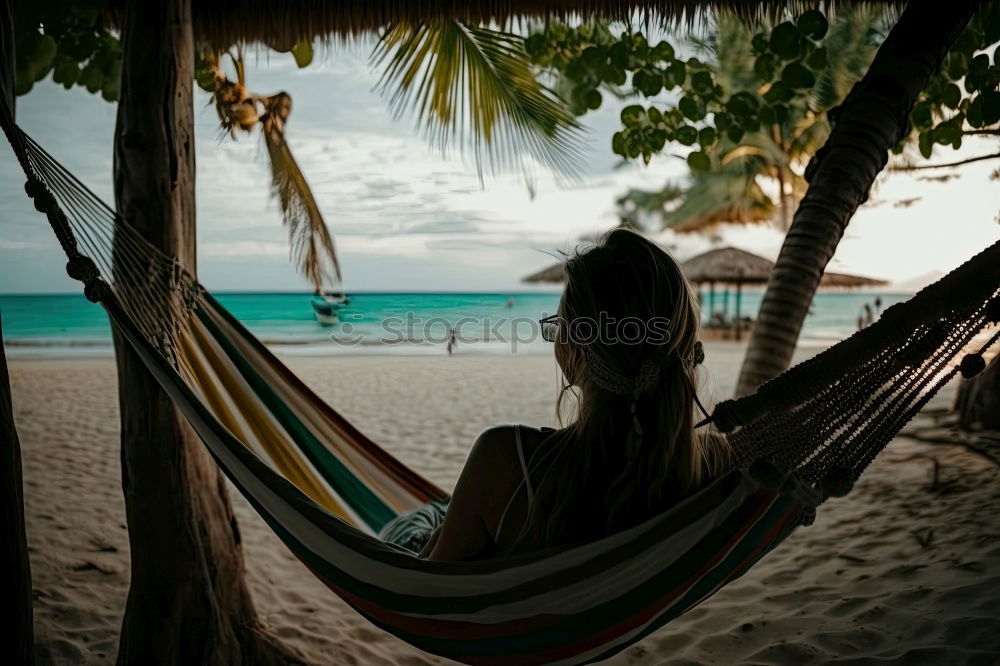 Similar – Maldives island luxury resort palm tree with hanging hammock