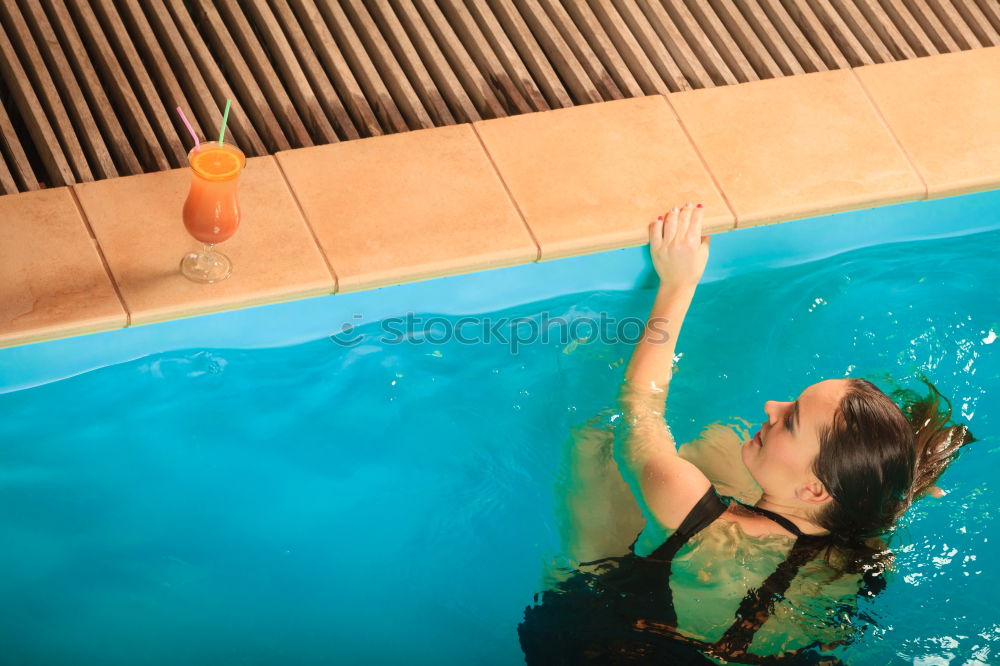 Image, Stock Photo Woman legs in a swimming pool with lifesaver