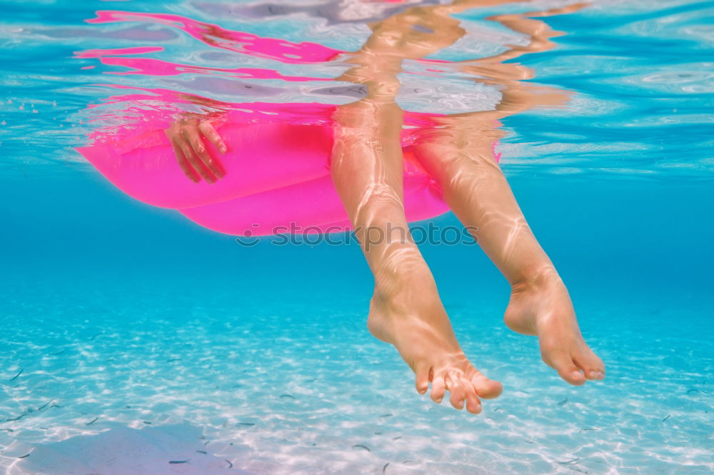 Image, Stock Photo Woman relaxing on inflatable ring in swimming pool