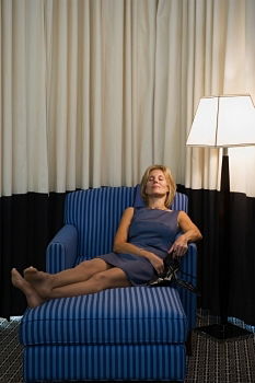 Similar – Image, Stock Photo Young woman with long legs sits barefoot on the couch