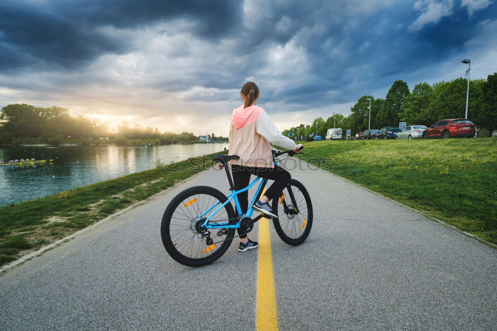 Similar – Image, Stock Photo Young man posing with bike on pavement