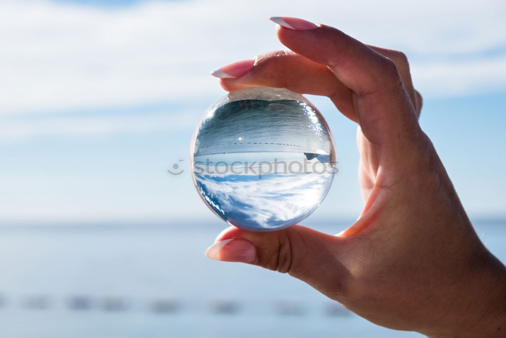 Similar – Image, Stock Photo Hand with compass at mountain road at blue sky