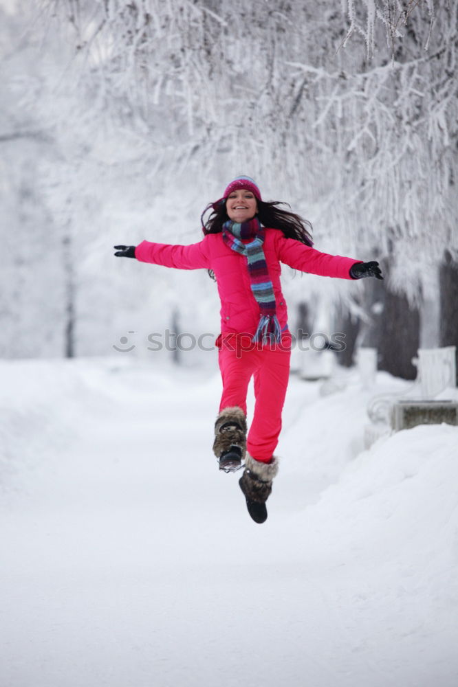 Similar – Mother enjoying the snow with her daughter outdoors