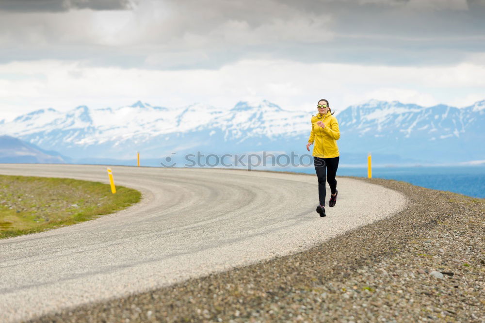 Similar – Image, Stock Photo jumping woman on a country road with mountains in the background