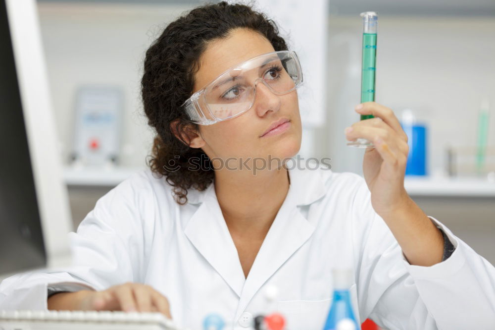 Similar – Image, Stock Photo Woman looking at test tube