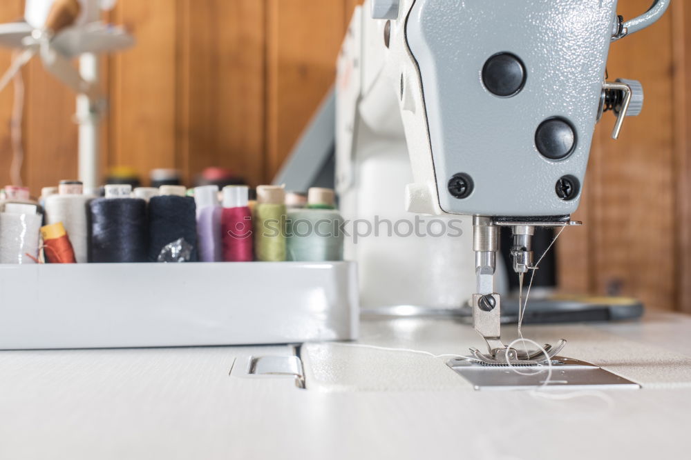 Image, Stock Photo Woman sewing on a sewing machine