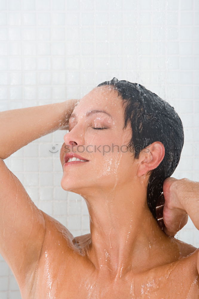 Similar – Young woman reacting in shock under shower