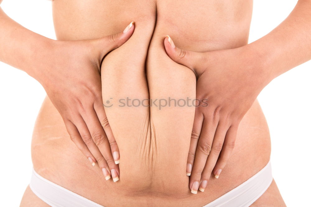 Similar – Hands massaging female abdomen.