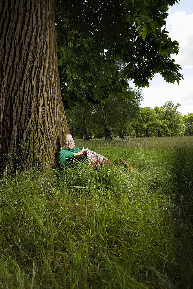 Child swinging on a tree swing in the forest