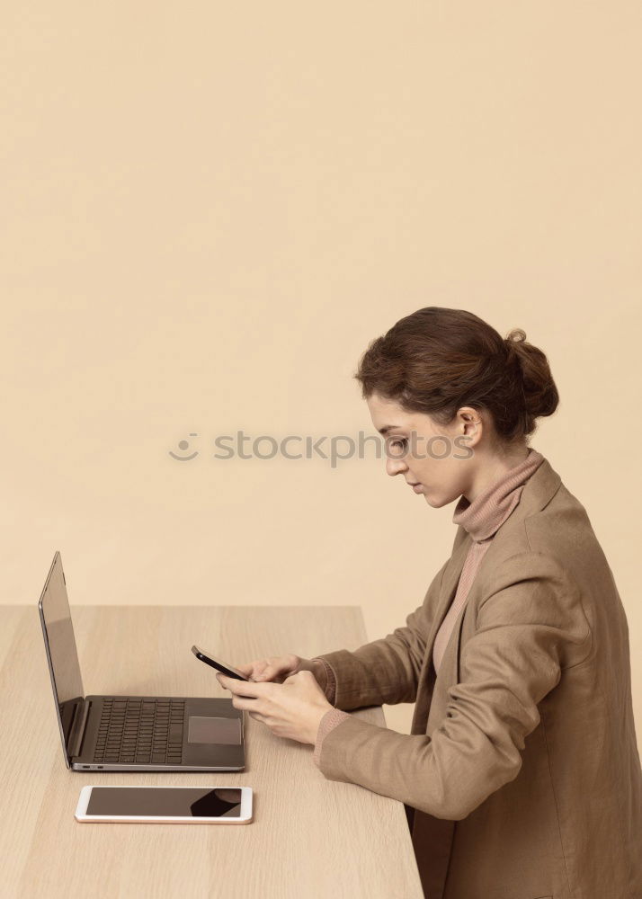 Similar – Concentrated young lady using laptop and sitting at table