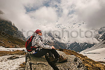 Similar – Image, Stock Photo Backpacker resting.