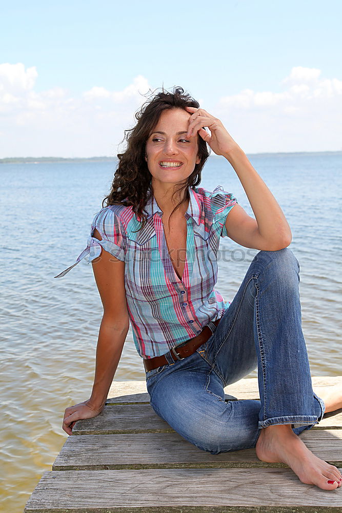 Similar – Image, Stock Photo Young girl sitting on jetty over the lake and dipping feet in water on sunny day in the summertime