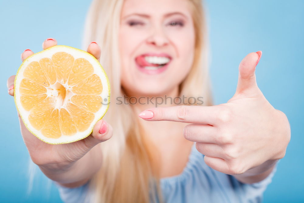 Similar – smiling little girl holding oranges over her eyes