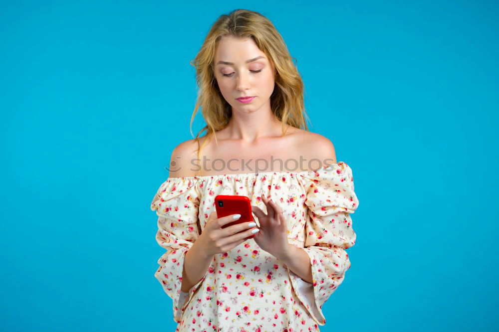 Similar – Image, Stock Photo Young woman in yellow dress using mobile phone
