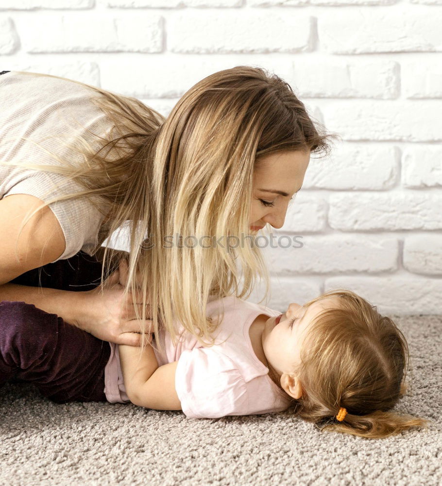 Similar – Image, Stock Photo Happy Mother tickling her cute toddler son at home