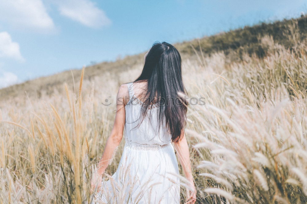 Similar – Mother walking with daughter through the fields